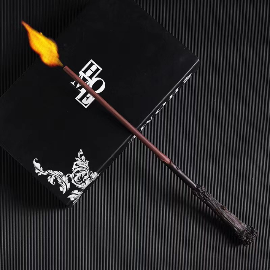Harry Potter fireball wand featuring a burnt wood-textured handle with a bright flame at the tip.